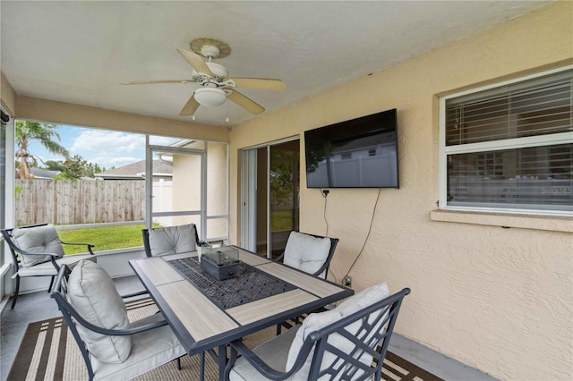 4649 72nd Ct E, Bradenton, FL 34203 - sunroom featuring ceiling fan and outdoor dining area