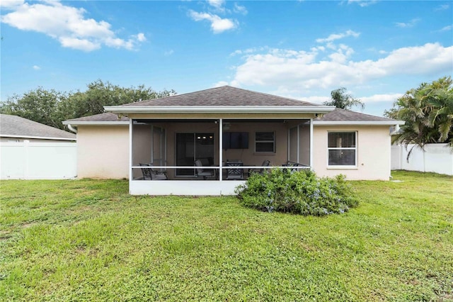 4649 72nd Ct E, Bradenton, FL 34203 - back of house featuring stucco siding and a sunroom