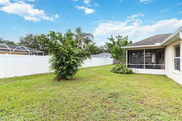 4649 72nd Ct E, Bradenton, FL 34203 - fenced backyard featuring a sunroom