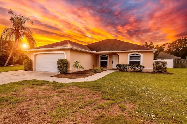 4649 72nd Ct E, Bradenton, FL 34203 - view of front of property with driveway, stucco siding, and a garage