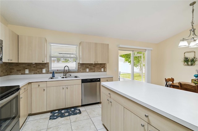 4649 72nd Ct E, Bradenton, FL 34203 - kitchen featuring appliances with stainless steel finishes, light brown cabinets, and light countertops