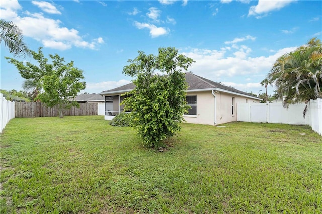 4649 72nd Ct E, Bradenton, FL 34203 - back of property featuring a fenced backyard and stucco siding