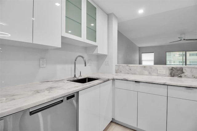 1150 Tarpon Center Dr Unit 1-C # 103, Venice, FL 34285 - kitchen featuring white cabinetry, stainless steel dishwasher, light stone countertops, and modern cabinets