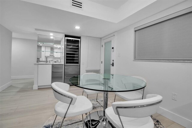 1150 Tarpon Center Dr Unit 1-C # 103, Venice, FL 34285 - dining room with recessed lighting, light wood finished floors, and wine cooler
