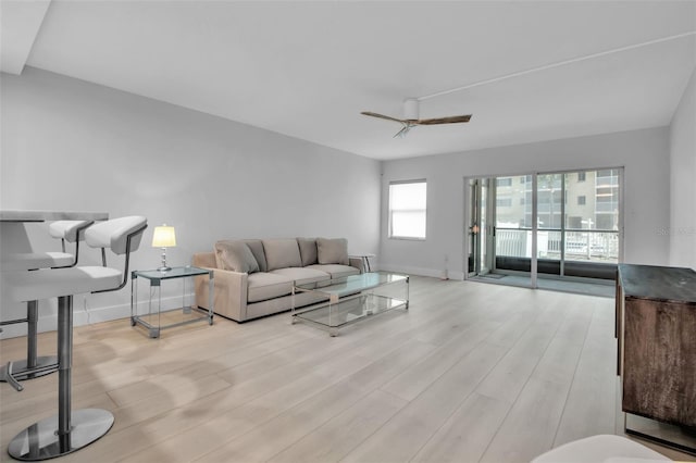 1150 Tarpon Center Dr Unit 1-C # 103, Venice, FL 34285 - living area with wood finished floors and a ceiling fan