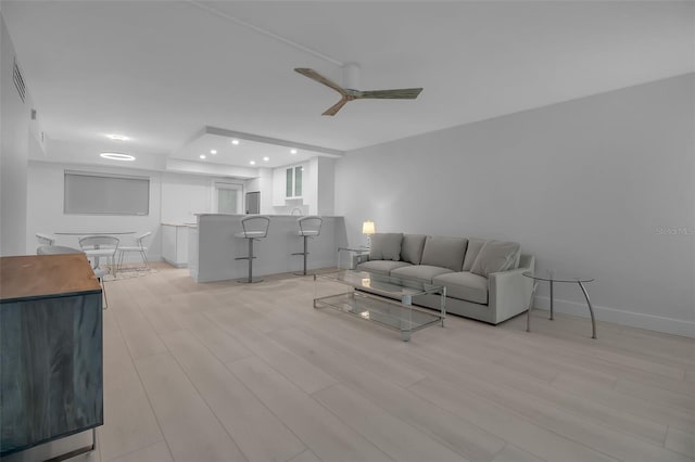 1150 Tarpon Center Dr Unit 1-C # 103, Venice, FL 34285 - living room featuring light wood-type flooring, a ceiling fan, and recessed lighting