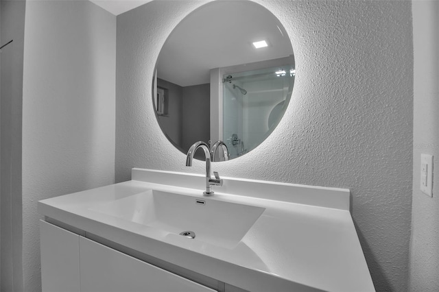 1150 Tarpon Center Dr Unit 1-C # 103, Venice, FL 34285 - full bath featuring a textured wall, vanity, and a shower