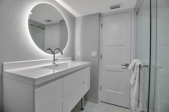1150 Tarpon Center Dr Unit 1-C # 103, Venice, FL 34285 - full bathroom with a textured wall and vanity