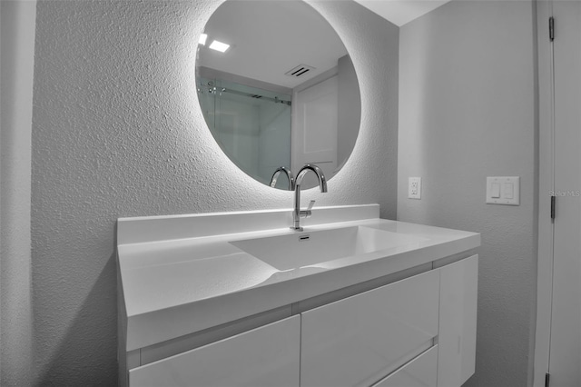 1150 Tarpon Center Dr Unit 1-C # 103, Venice, FL 34285 - bathroom with a textured wall and vanity