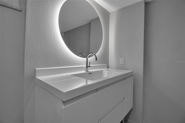 1150 Tarpon Center Dr Unit 1-C # 103, Venice, FL 34285 - bathroom with vanity and a textured wall