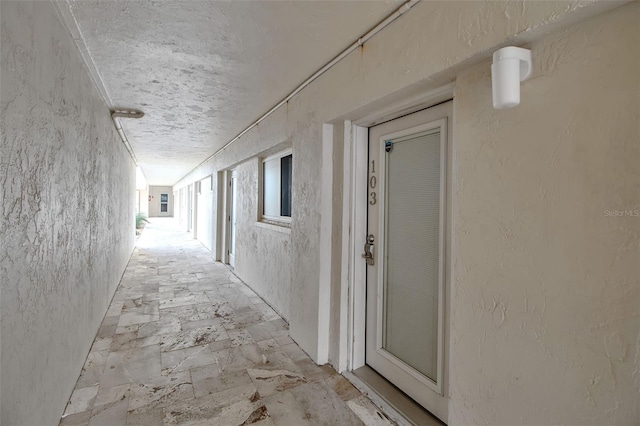 1150 Tarpon Center Dr Unit 1-C # 103, Venice, FL 34285 - corridor with a textured wall