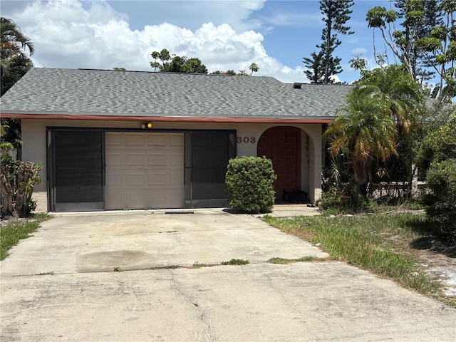 303 70th St NW, Bradenton, FL 34209 - ranch-style house with driveway, stucco siding, an attached garage, and a shingled roof