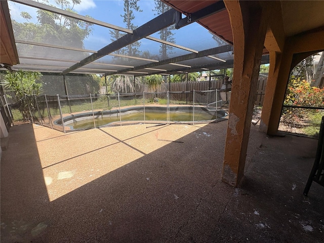 303 70th St NW, Bradenton, FL 34209 - fenced backyard with a patio area and glass enclosure
