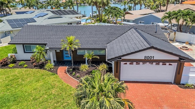8001 13th Ave S, Saint Petersburg, FL 33707 - view of front of property featuring a tiled roof, a water view, and stucco siding