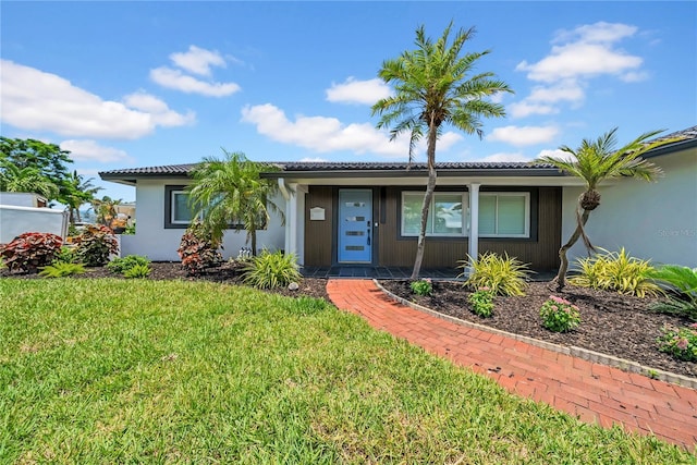 8001 13th Ave S, Saint Petersburg, FL 33707 - single story home featuring a front yard and stucco siding