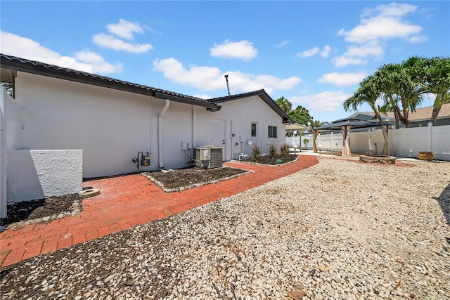 8001 13th Ave S, Saint Petersburg, FL 33707 - back of property with a gazebo, a patio area, and stucco siding