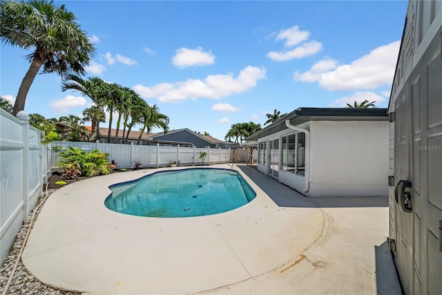 8001 13th Ave S, Saint Petersburg, FL 33707 - view of swimming pool featuring a patio area and a fenced backyard