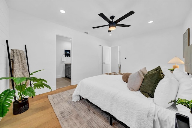 8001 13th Ave S, Saint Petersburg, FL 33707 - bedroom with recessed lighting, wood finished floors, ensuite bathroom, and ceiling fan