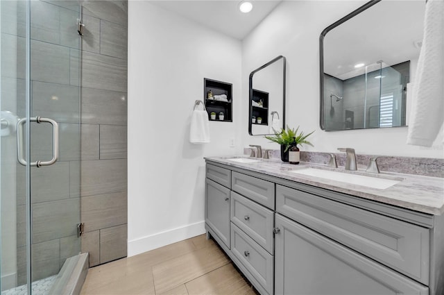 8001 13th Ave S, Saint Petersburg, FL 33707 - full bath featuring double vanity, a shower stall, and recessed lighting