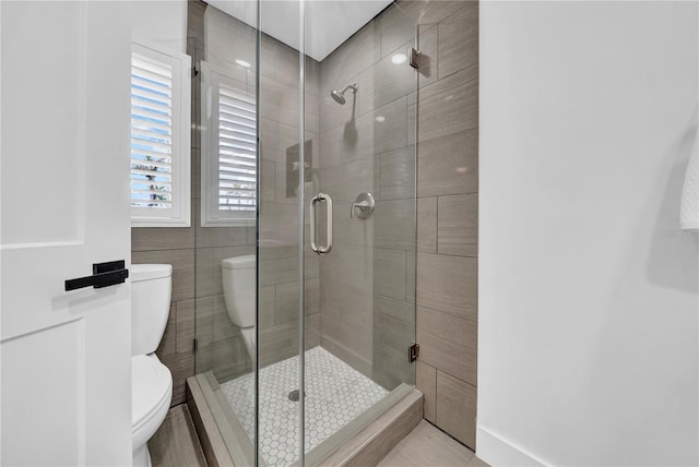 8001 13th Ave S, Saint Petersburg, FL 33707 - bathroom with toilet and a stall shower