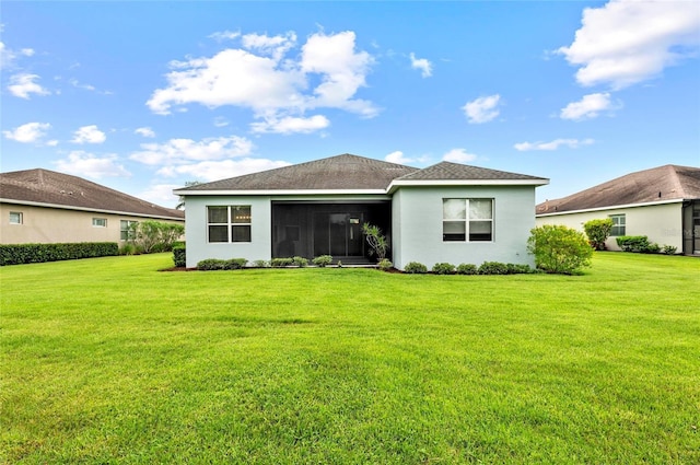 4654 Claremont Park Dr, Bradenton, FL 34211 - rear view of house with a yard, stucco siding, and a sunroom