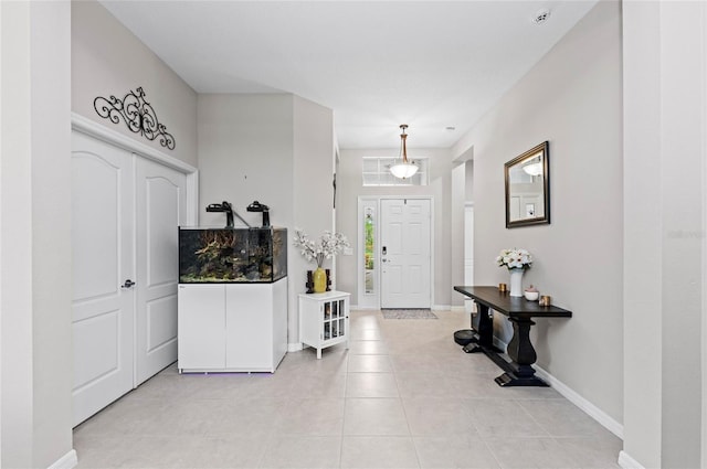 4654 Claremont Park Dr, Bradenton, FL 34211 - entryway with light tile patterned floors and baseboards