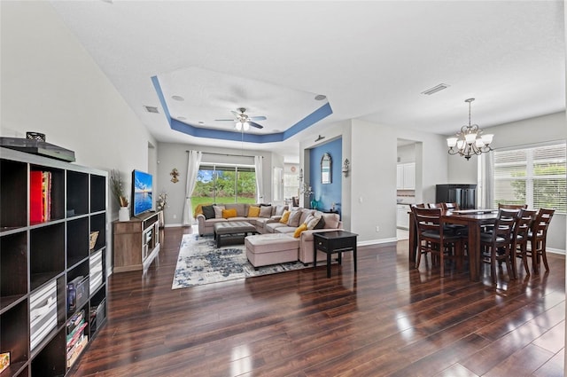 4654 Claremont Park Dr, Bradenton, FL 34211 - living area featuring wood finished floors, healthy amount of natural light, a ceiling fan, and a chandelier