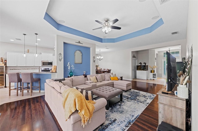 4654 Claremont Park Dr, Bradenton, FL 34211 - living area featuring a raised ceiling, ceiling fan, dark wood-style flooring, wine cooler, and recessed lighting
