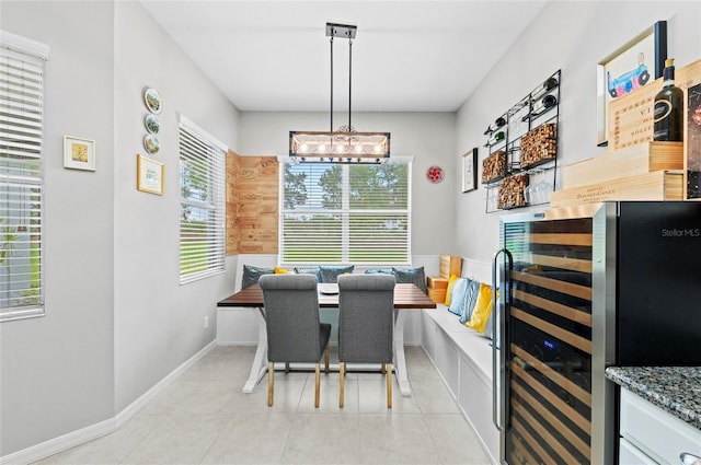 4654 Claremont Park Dr, Bradenton, FL 34211 - dining space featuring wine cooler and a chandelier
