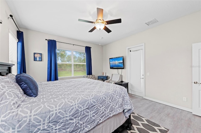 4654 Claremont Park Dr, Bradenton, FL 34211 - bedroom with wood finished floors and ceiling fan
