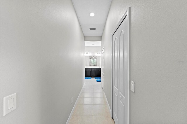 4654 Claremont Park Dr, Bradenton, FL 34211 - hallway with light tile patterned floors and baseboards