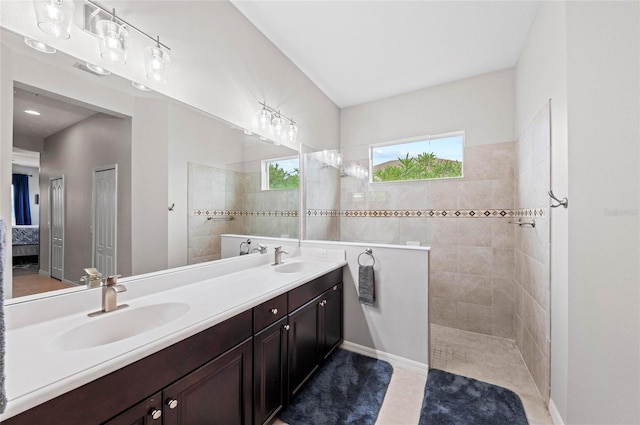 4654 Claremont Park Dr, Bradenton, FL 34211 - bathroom featuring walk in shower, double vanity, and ensuite bathroom