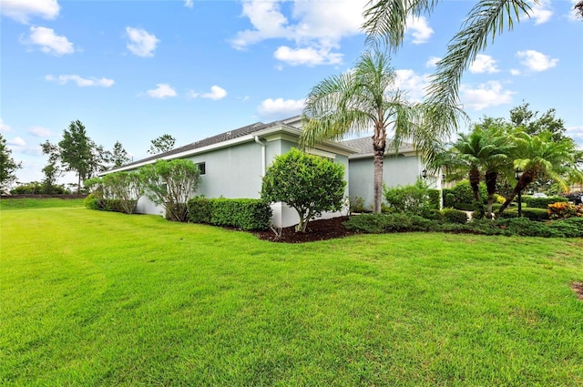 4654 Claremont Park Dr, Bradenton, FL 34211 - view of home's exterior with stucco siding and a yard