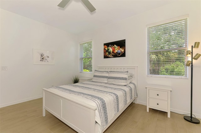 3602 Secret Stroll Dr, Sarasota, FL 34240 - bedroom with light wood finished floors and a ceiling fan