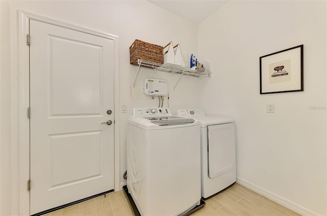 3602 Secret Stroll Dr, Sarasota, FL 34240 - laundry area with independent washer and dryer and light wood-style flooring