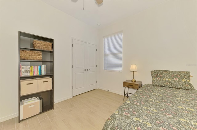 3602 Secret Stroll Dr, Sarasota, FL 34240 - bedroom featuring wood finished floors and ceiling fan