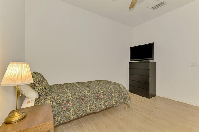 3602 Secret Stroll Dr, Sarasota, FL 34240 - bedroom with wood finished floors and a ceiling fan