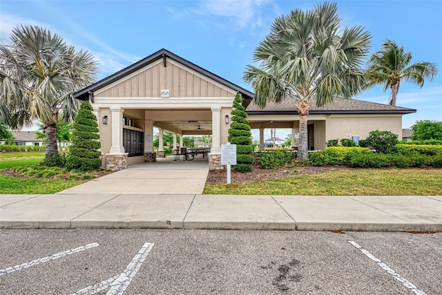 3602 Secret Stroll Dr, Sarasota, FL 34240 - view of front of home with uncovered parking and stone siding