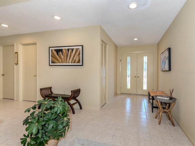 154 Inlets Blvd, Nokomis, FL 34275 - foyer with recessed lighting, a textured ceiling, and french doors