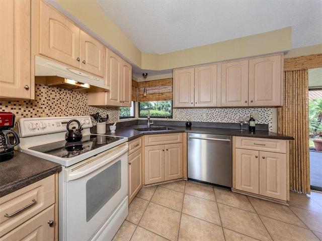 154 Inlets Blvd, Nokomis, FL 34275 - kitchen featuring stainless steel dishwasher, white electric stove, under cabinet range hood, backsplash, and healthy amount of natural light