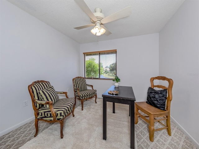 154 Inlets Blvd, Nokomis, FL 34275 - sitting room with light carpet, ceiling fan, and a textured ceiling
