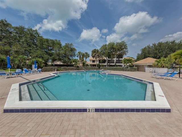 154 Inlets Blvd, Nokomis, FL 34275 - community pool featuring a patio area