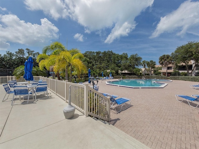 154 Inlets Blvd, Nokomis, FL 34275 - community pool featuring a patio area
