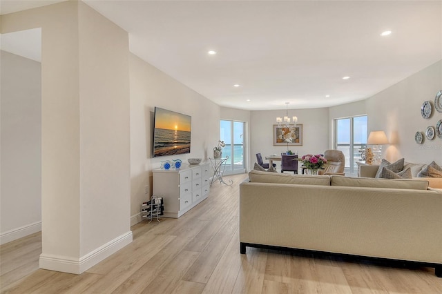 1000 Longboat Club Rd Unit 1105, Longboat Key, FL 34228 - living room with a chandelier, light wood-style flooring, and recessed lighting