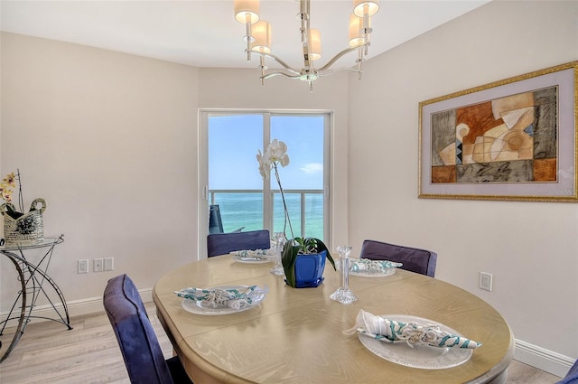 1000 Longboat Club Rd Unit 1105, Longboat Key, FL 34228 - dining room featuring a chandelier and wood finished floors