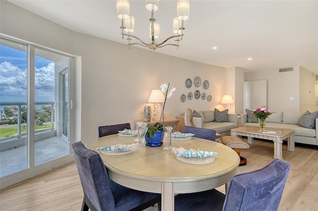 1000 Longboat Club Rd Unit 1105, Longboat Key, FL 34228 - dining area featuring light wood-style floors, a chandelier, and recessed lighting