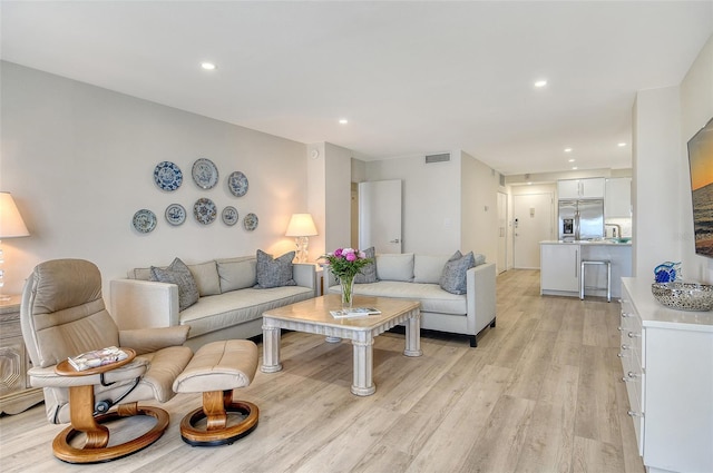 1000 Longboat Club Rd Unit 1105, Longboat Key, FL 34228 - living room featuring light wood-style floors and recessed lighting