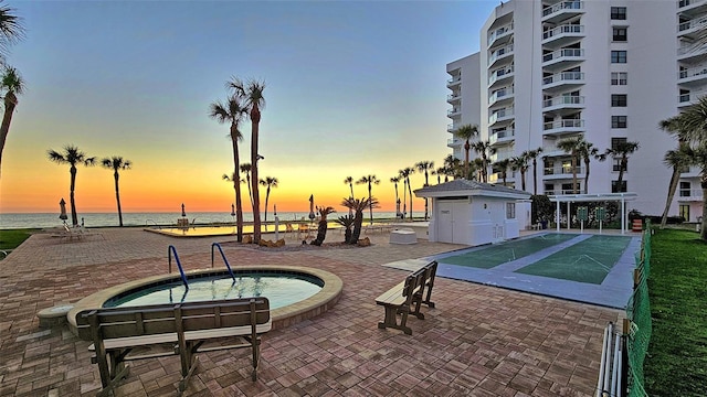 1000 Longboat Club Rd Unit 1105, Longboat Key, FL 34228 - view of swimming pool with a community hot tub, a water view, and shuffleboard