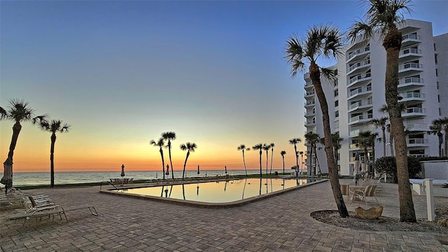 1000 Longboat Club Rd Unit 1105, Longboat Key, FL 34228 - pool at dusk with a water view