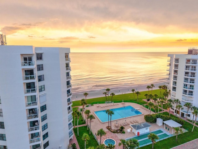 1000 Longboat Club Rd Unit 1105, Longboat Key, FL 34228 - pool at dusk with a water view and a community pool